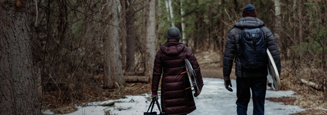a group of friends on a porch wearing KÜHL clothing.